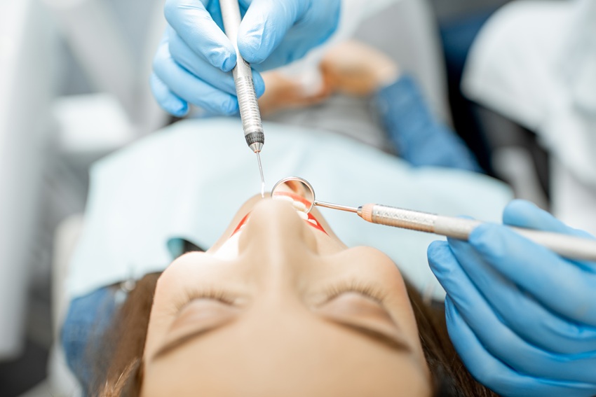 Close-up view on the woman's face during the dental examination