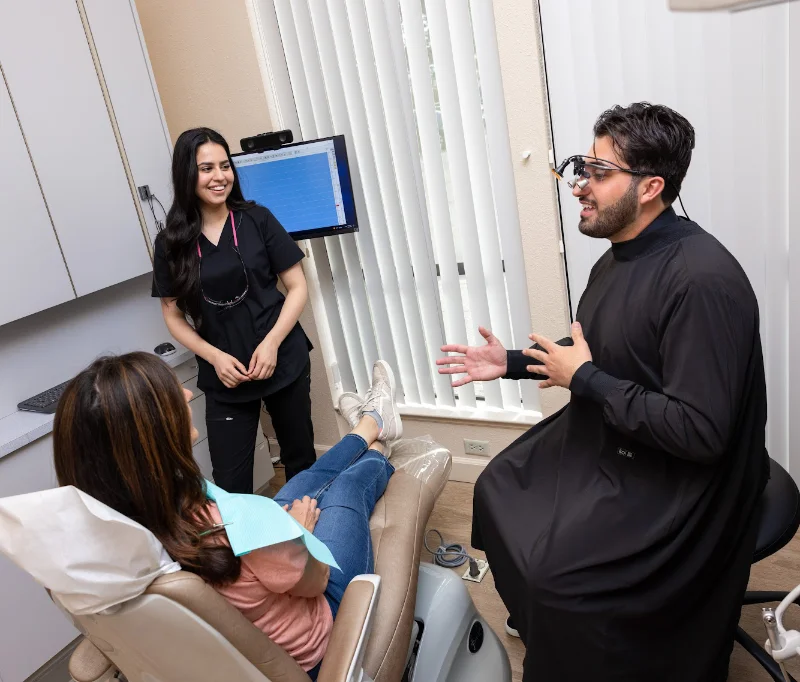 Dr. Niko at an invisalign consultation discussing patient options.