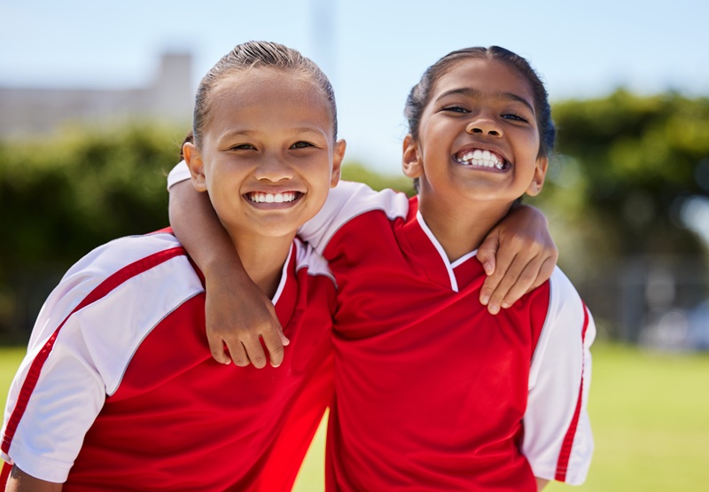 Soccer, portrait and friends in a girl football sports team for children ready to start training